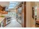 Gourmet kitchen featuring stainless steel appliances and ample cabinet space under skylights at 1757 E Clifton Ne Rd, Atlanta, GA 30307