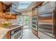 Well-lit kitchen with stainless steel appliances and access to outdoor dining at 1757 E Clifton Ne Rd, Atlanta, GA 30307