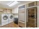 Well-equipped laundry room with wine cooler and storage cabinets at 1757 E Clifton Ne Rd, Atlanta, GA 30307