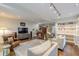 Open concept living room featuring hardwood floors, built-in bookshelves, and track lighting at 1757 E Clifton Ne Rd, Atlanta, GA 30307