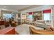 Inviting living room with stone fireplace, built-in shelves, hardwood floors, and ample seating space at 1757 E Clifton Ne Rd, Atlanta, GA 30307