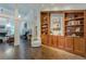 Open living area with built-in bookshelves and a fireplace at 1757 E Clifton Ne Rd, Atlanta, GA 30307