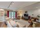 This living room features hardwood floors, white walls, built-in bookshelves, and an entertainment area at 1757 E Clifton Ne Rd, Atlanta, GA 30307