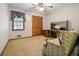Bedroom with a closet, desk, chair, and a window offering natural light at 267 Firecreek Rdg, Lawrenceville, GA 30046
