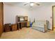 Neutral bedroom featuring a desk, sofa, and ceiling fan at 267 Firecreek Rdg, Lawrenceville, GA 30046