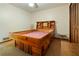 Cozy bedroom features a unique wooden bed frame with storage and vintage wallpaper at 267 Firecreek Rdg, Lawrenceville, GA 30046