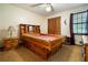 Bedroom showcases a unique wooden bed frame with storage and a window at 267 Firecreek Rdg, Lawrenceville, GA 30046