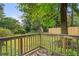 Rustic wooden deck overlooking a lush backyard, creating a serene outdoor retreat at 267 Firecreek Rdg, Lawrenceville, GA 30046