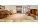 Spacious living room features a stone fireplace, piano, and comfortable seating area at 267 Firecreek Rdg, Lawrenceville, GA 30046