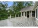 Expansive back deck provides the perfect space for outdoor entertaining with lush backyard views at 5065 Nesbit Ferry Ln, Atlanta, GA 30350