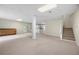 Large basement with stairwell, cabinets, tile flooring at 5065 Nesbit Ferry Ln, Atlanta, GA 30350