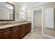 Spacious bathroom with double sink vanity with plenty of storage and natural light at 5065 Nesbit Ferry Ln, Atlanta, GA 30350