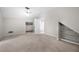 Spacious bedroom features plush carpet, closet, built-in shelving, and neutral paint at 5065 Nesbit Ferry Ln, Atlanta, GA 30350