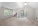 Bedroom with carpet, built-in nook, and outdoor access at 5065 Nesbit Ferry Ln, Atlanta, GA 30350