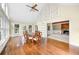 Formal dining room with hardwood floors, large windows, and views of the living area at 5065 Nesbit Ferry Ln, Atlanta, GA 30350