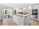 Updated kitchen featuring white cabinetry, granite countertops, and stainless steel appliances at 5065 Nesbit Ferry Ln, Atlanta, GA 30350