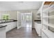 Kitchen with white cabinetry, stone countertops and stainless steel appliances at 5065 Nesbit Ferry Ln, Atlanta, GA 30350
