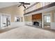 Spacious living room with fireplace and view of the loft and kitchen at 5065 Nesbit Ferry Ln, Atlanta, GA 30350