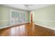 Sun-filled room boasting classic molding, hardwood floors, and natural light at 5065 Nesbit Ferry Ln, Atlanta, GA 30350