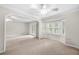 Inviting living room with large windows, carpet floors, and plenty of natural light at 5065 Nesbit Ferry Ln, Atlanta, GA 30350