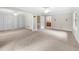 Spacious carpeted main bedroom featuring dual closets and ensuite bathroom at 5065 Nesbit Ferry Ln, Atlanta, GA 30350