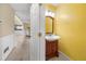 Charming powder room features a stylish vanity and decorative lighting fixture at 5065 Nesbit Ferry Ln, Atlanta, GA 30350