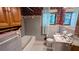 Bathroom featuring colorful tiles, a bath tub, a vanity, and a window at 5508 Zanola Sw Dr, Mableton, GA 30126
