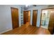 Bedroom with hardwood floors, open bathroom, and lots of natural light at 5508 Zanola Sw Dr, Mableton, GA 30126