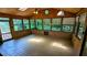 Sunroom featuring wood paneling, ceiling fan, skylights, and lots of windows at 5508 Zanola Sw Dr, Mableton, GA 30126