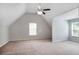 Spacious bedroom featuring vaulted ceilings, plush carpet, and bright windows at 5380 Bridle Point Pkwy, Snellville, GA 30039