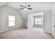 Large bedroom with neutral walls, plush carpeting, and ample natural light at 5380 Bridle Point Pkwy, Snellville, GA 30039