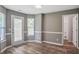 Bright dining area featuring a door to the outside and access to a laundry room at 5380 Bridle Point Pkwy, Snellville, GA 30039