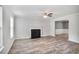 Bright living room featuring a fireplace, hardwood flooring, and neutral walls at 5380 Bridle Point Pkwy, Snellville, GA 30039