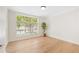 Bright bedroom boasts natural light from a large window and light-colored hardwood flooring throughout at 625 Piedmont Ne Ave # 105, Atlanta, GA 30308