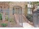 Exterior shot of the building entrance with brick stairs and a stone facade at 625 Piedmont Ne Ave # 105, Atlanta, GA 30308
