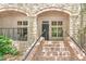 Inviting front entrance featuring brick stairs, stone archway, and well-maintained landscaping at 625 Piedmont Ne Ave # 105, Atlanta, GA 30308