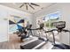 Bright fitness center featuring modern treadmills and exercise equipment with large windows overlooking outdoor pool area at 625 Piedmont Ne Ave # 105, Atlanta, GA 30308