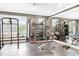 Well-equipped fitness center with weightlifting rack, punching bag, bench, and plenty of free weights at 625 Piedmont Ne Ave # 105, Atlanta, GA 30308
