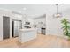 Modern kitchen with white cabinets, stainless steel appliances, and a light hardwood floor at 625 Piedmont Ne Ave # 105, Atlanta, GA 30308