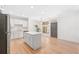 Open-concept kitchen with white cabinets, stainless steel appliances, and a center island at 625 Piedmont Ne Ave # 105, Atlanta, GA 30308