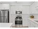 Well-equipped kitchen with white cabinets, stainless steel appliances, and subway tile backsplash at 625 Piedmont Ne Ave # 105, Atlanta, GA 30308