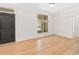 Open living space featuring hardwood floors, bright windows, and modern trim at 625 Piedmont Ne Ave # 105, Atlanta, GA 30308