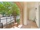Charming porch with brick flooring, stone accents, and a view of a tree-lined street at 625 Piedmont Ne Ave # 105, Atlanta, GA 30308