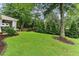 Lush green backyard with mature trees, offering privacy and a serene outdoor space at , Atlanta, GA 30360