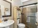 Bathroom with a stand-up shower, pedestal sink, and tile flooring at , Atlanta, GA 30360