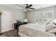 Neutral bedroom featuring plush carpet, window with shutters, and contemporary furnishings at , Atlanta, GA 30360