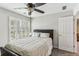 Cozy bedroom with shutters, ceiling fan, and neutral colors for a peaceful ambiance at , Atlanta, GA 30360