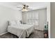 Comfortable bedroom with soft carpet, ceiling fan, and window shutters for a bright, airy feel at , Atlanta, GA 30360