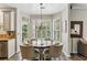 Charming dining area features a round table, shuttered windows, and a view to the outdoors at , Atlanta, GA 30360