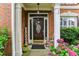 Inviting front entrance featuring a decorative door, brick columns and a 'Welcome' sign at , Atlanta, GA 30360